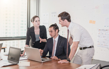 Image of business partners advice present discussing documents and ideas at meeting Group of business people sharing their ideas.