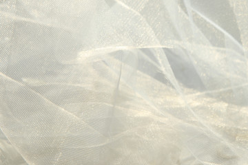 White tulle fabric background. Abstract transparent material curve wave.