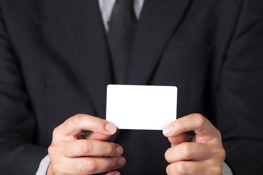 A Businessman showing his name card.