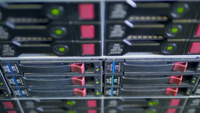 Black hard drives covered with small specks of dust. 