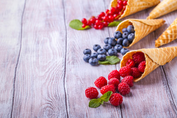 Sugar waffle cone with forest berries horizontal