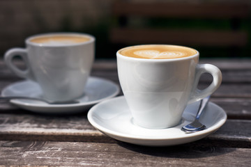 Two cups of cappuccino on the table