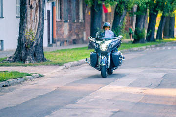 Man riding classic tourist motorbike