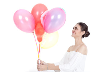 Young beautiful asian woman holding colorful balloon with happy emotion and fun, isolated on white background.