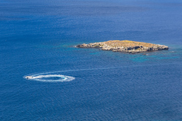 Boat on the Mediterranean Sea off the coast of the peninsula of Akamos, Cyprus