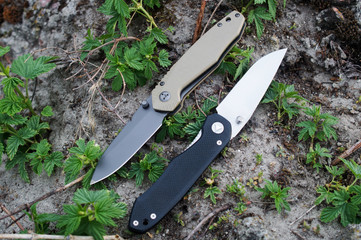 Two folding knives on the ground
