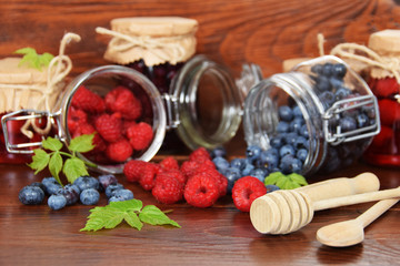 blueberries and raspberries in jars for the winter tea