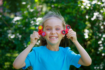girl holding popular fidget spinner toy