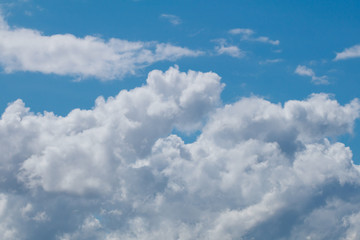 Naklejka na ściany i meble Beautiful large fluffy clouds in the sky