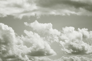A gloomy photo of large clouds in the sky. Black and white photography. Toned retro image.