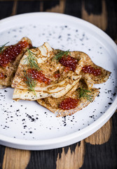 Pancakes with salmon caviar
