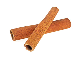 Two cinnamon sticks isolated on white background