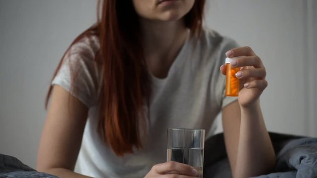 Sad distressed woman thinking about suicide