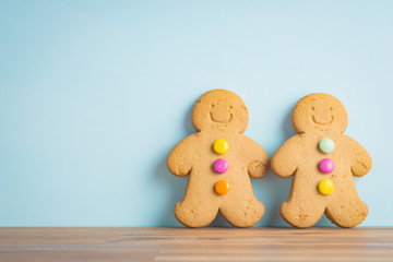 Gingerbread man leaning against the wall.