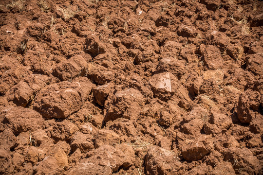 Close up of plowed red soil. Arable land in Algarve Portugal.