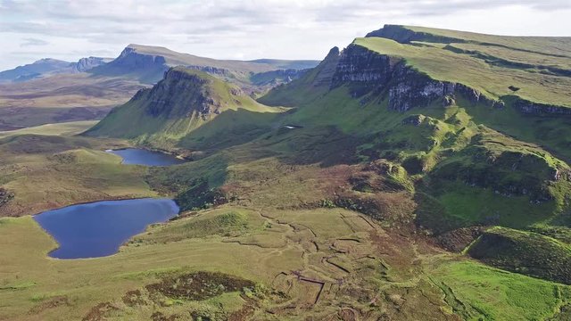 Cinematic flight over the Quiraing on the eastern face of Meall na Suiramach, Isle of Skye, Highland, Scotland