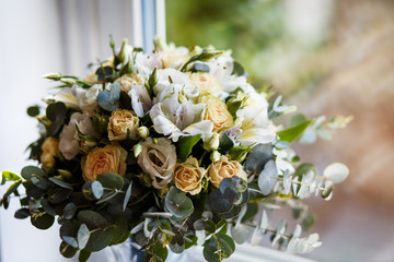 Obraz na płótnie Canvas stylish wedding bouquet with yellow roses and eucalyptus