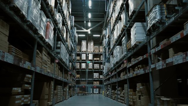 Steadycam shot of big warehouse with many goods for building or repair. Shopping mall or stock with stuff for decoration