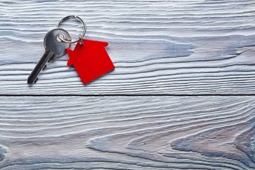Real estate concept, Key ring and keys on wooden background