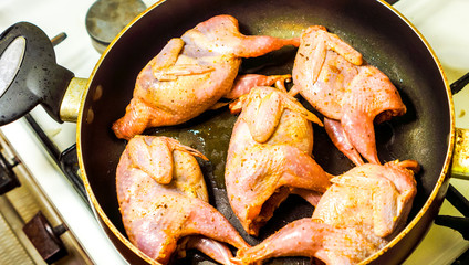 Fresh raw meat on the board quail