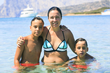 Fototapeta premium Family swimming on the beach