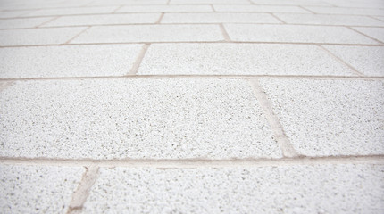close up view of white or grey brick