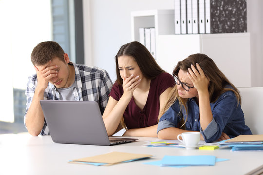 Worried business team watching on line content