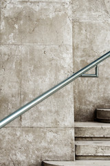 Steel railing on an ancient marble staircase