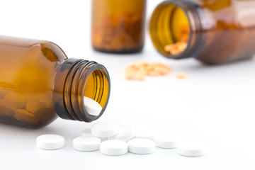pills pouring out of the bottle