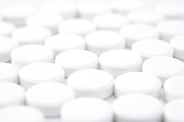 pattern of white round pills