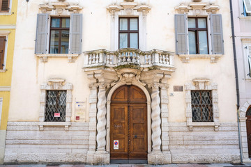 Fototapeta na wymiar Trento, Itali - June, 25, 2017: facade of an ancient house in Trento, Italy