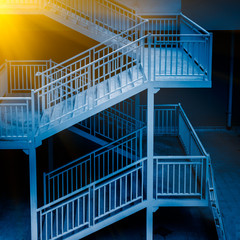Fototapeta premium Full Frame Shot Of Metallic Fire Escape in blue tone.