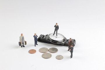 mini figure stack of coins and watch