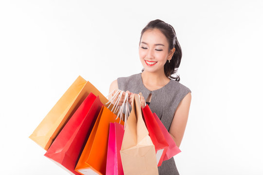 Happy Asian woman smile with shopping bags,Isolated on white background