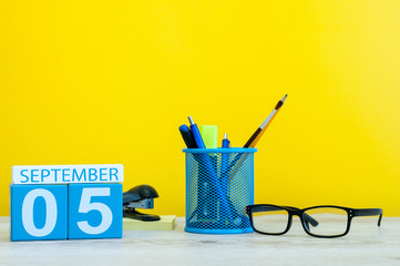 5th September. Image of september 5, calendar on yellow background with office supplies. Back to school concept