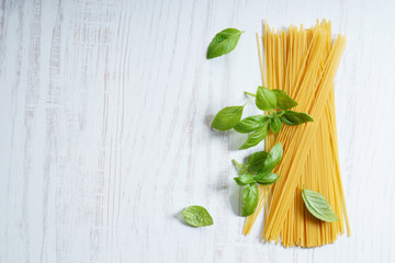 dried pasta, spaghetti, with fresh basil.