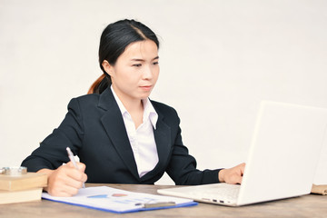 Close up of businesswomen writing on paper sheet in office selective and soft focus