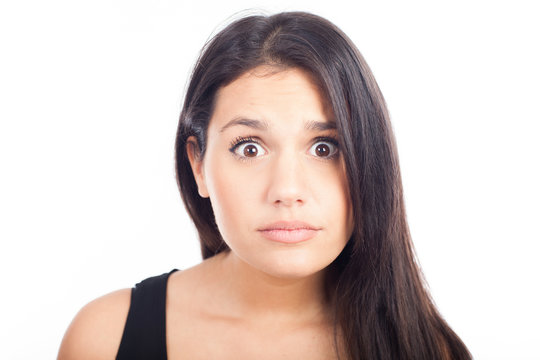 Close up portrait of pretty surprised woman  on white background