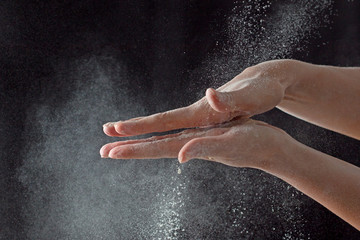 Fototapeta na wymiar Hands in flour