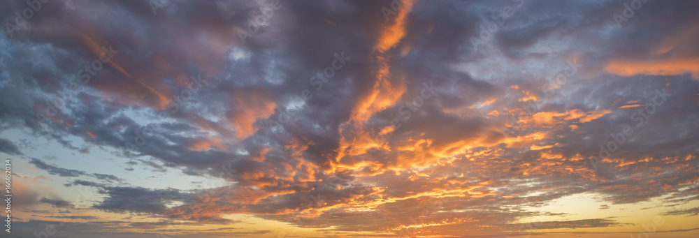 Wall mural fiery sunset, colorful clouds in the sky