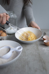 Fototapeta na wymiar Whisking the eggs (baking in process)