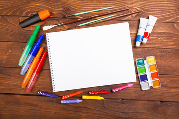 Desk cluttered with office supplies