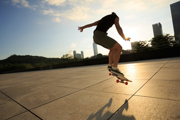 Woman practicing with skateboard at sunrise city © lzf