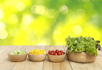 Healthy food concept of fresh vegetables in wooden bowl with space on abstract bokeh bokeh