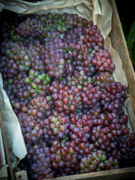 Natural-looking fruits in a supermarket - grapes.
