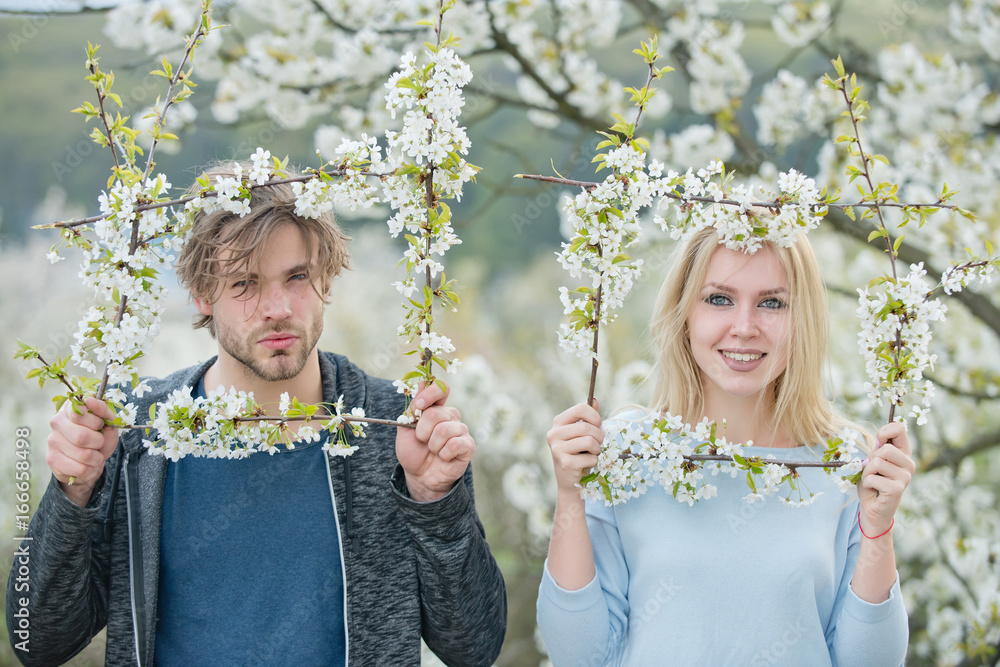 Wall mural Girl and guy cherry bloom frame.