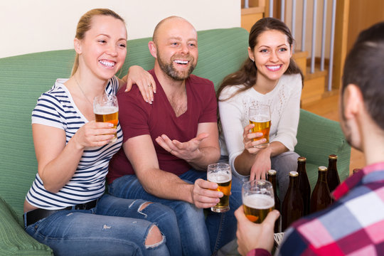 Adults drinking beer indoor