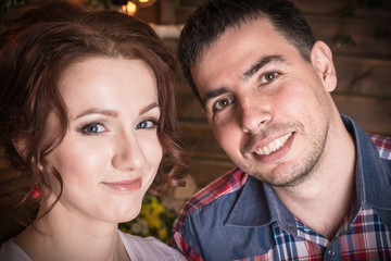 Beautiful couple in a rustic interior