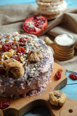 Homemade vegetarian pie with dried fruits on a blue background