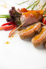 cold boiled pork with tomatoes on a white background